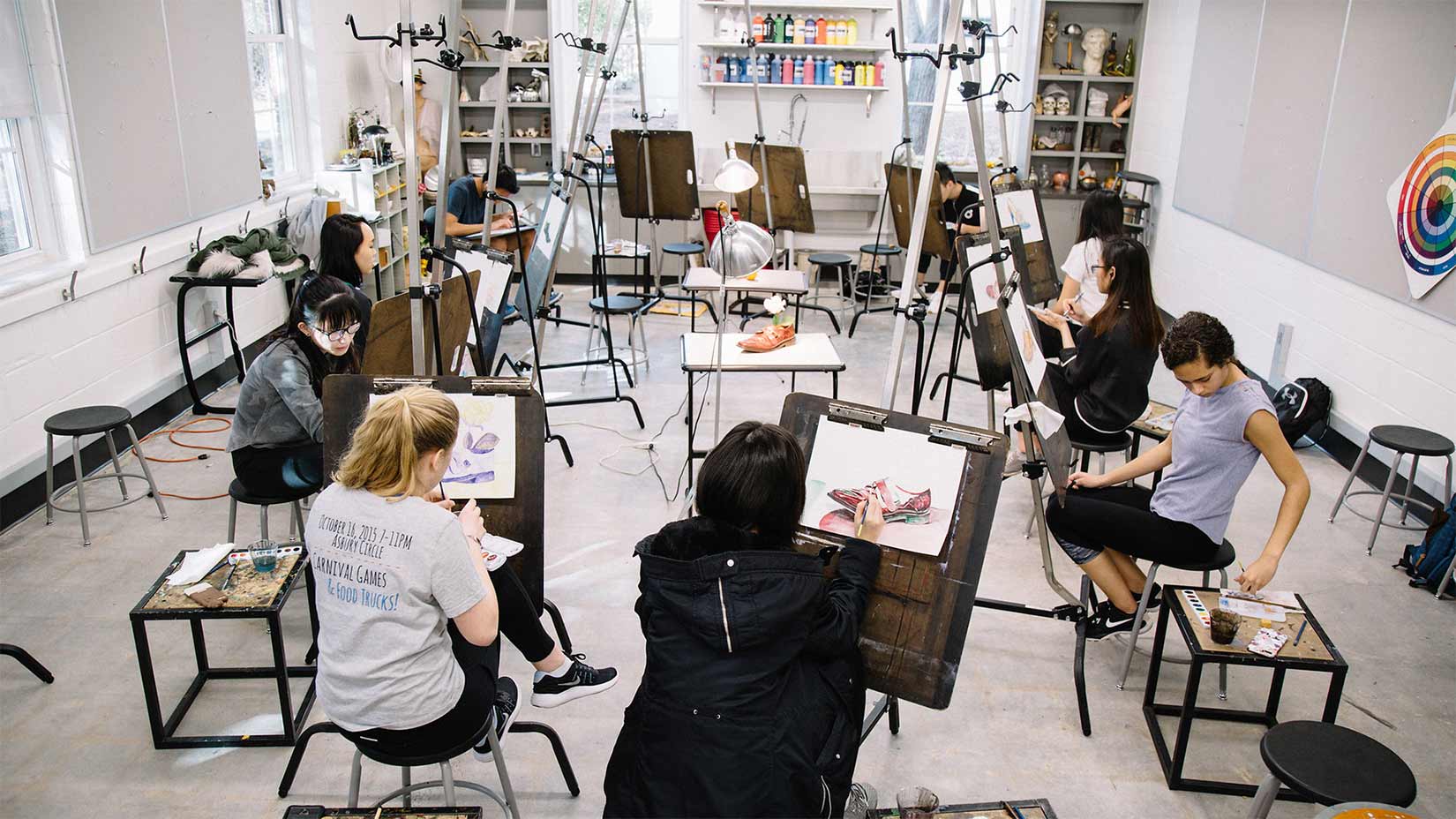 Students work on their paintings in art studio in Pierce Hall.