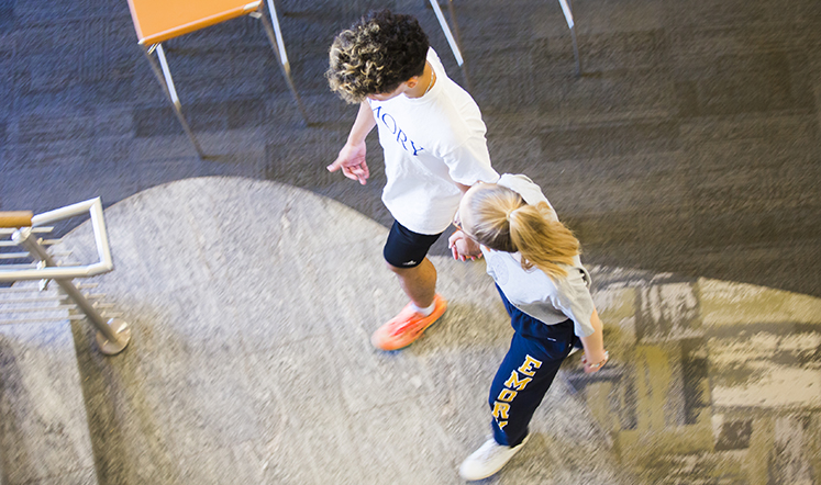 Oxford students climb up the library stairs