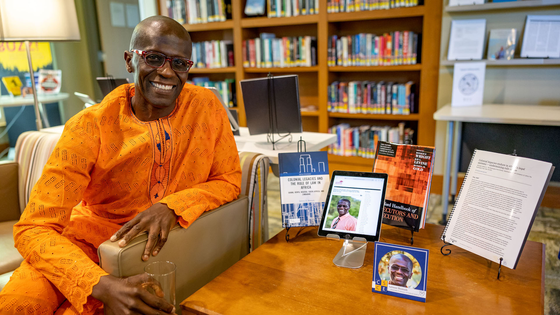 Salmon Shomade poses with his published research.