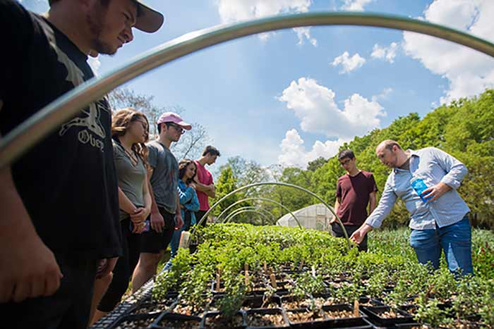 Deric Shannon with his students at the organic farm.