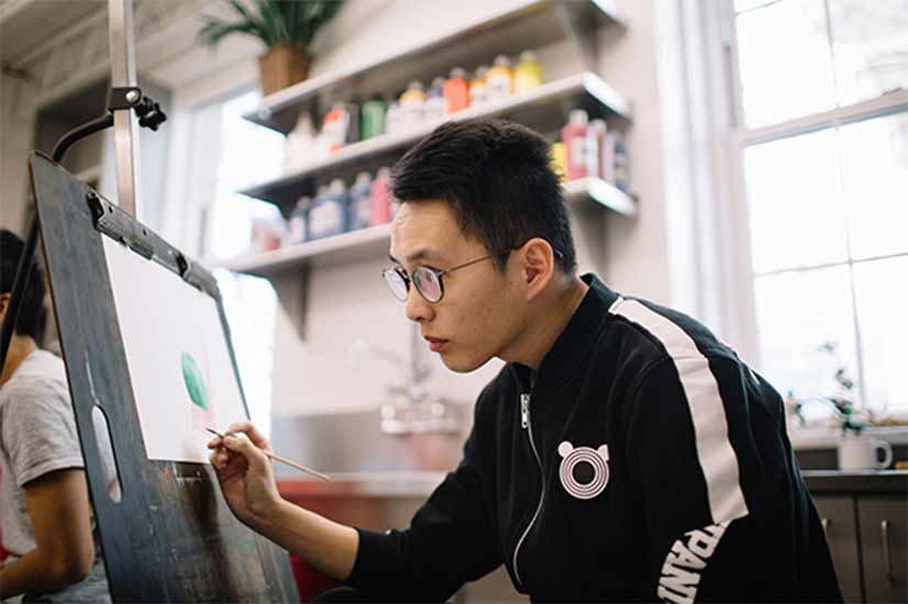 A student works on a project in the Pierce Hall art studio.