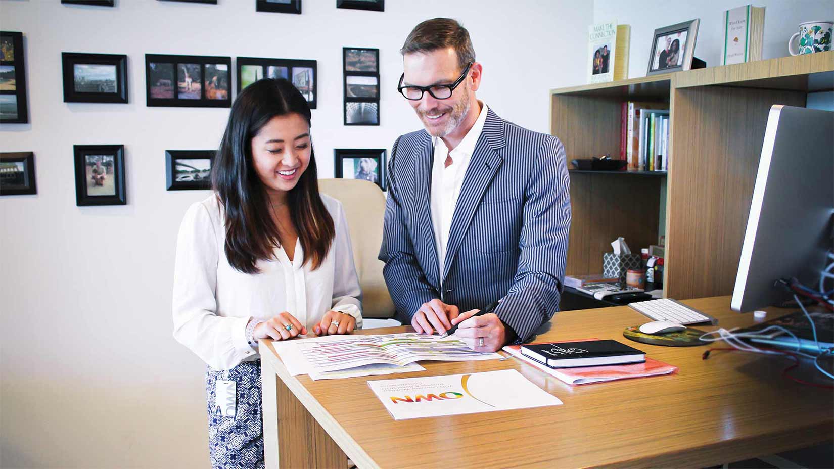 An Oxford student goes over a work assignment with her supervisor.