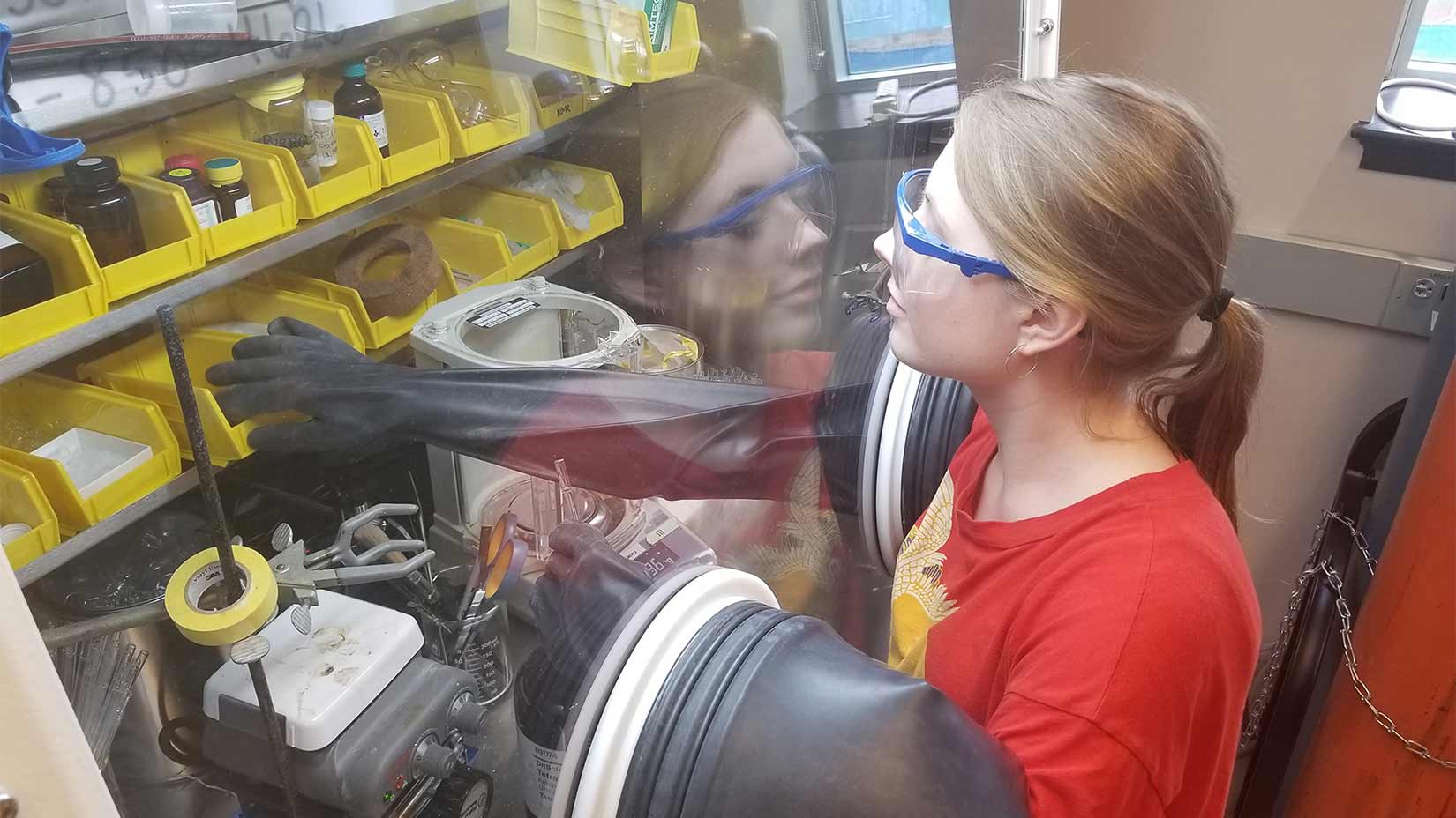 An Oxford student performs an experiment in the lab.