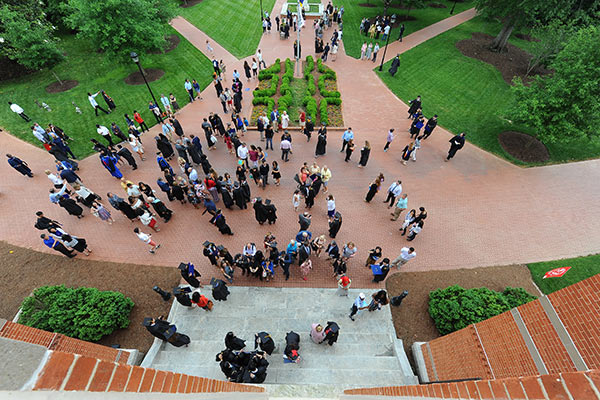 Students and families celebrate Commencement on the quad.