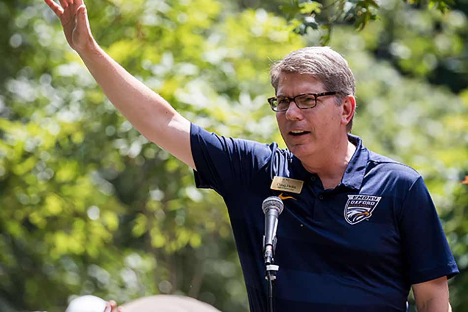 Dean Douglas Hicks welcomes students at orientation.