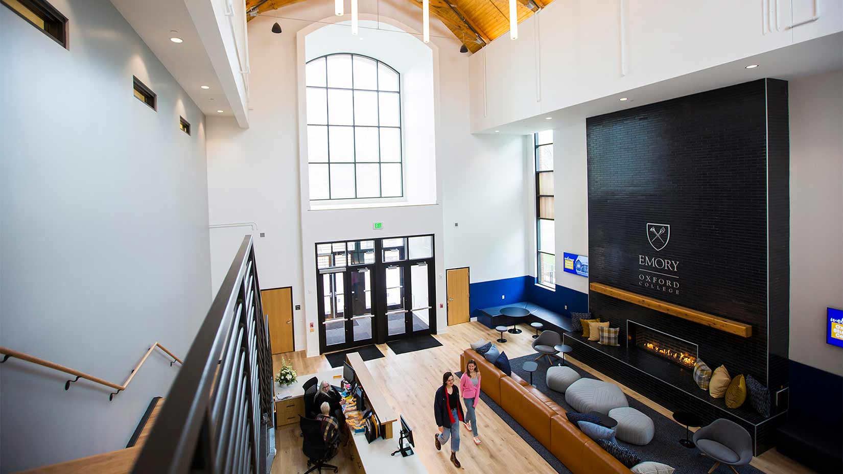 Students talk in one of the gathering spaces in Pierce Hall.