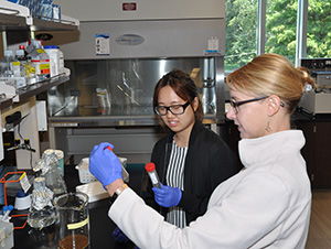 Sarah Fankhauser and Linda Wu study organic farming strategies.