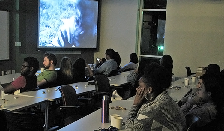 Students watch I Am Not Your Negro at the inaugural film screening.