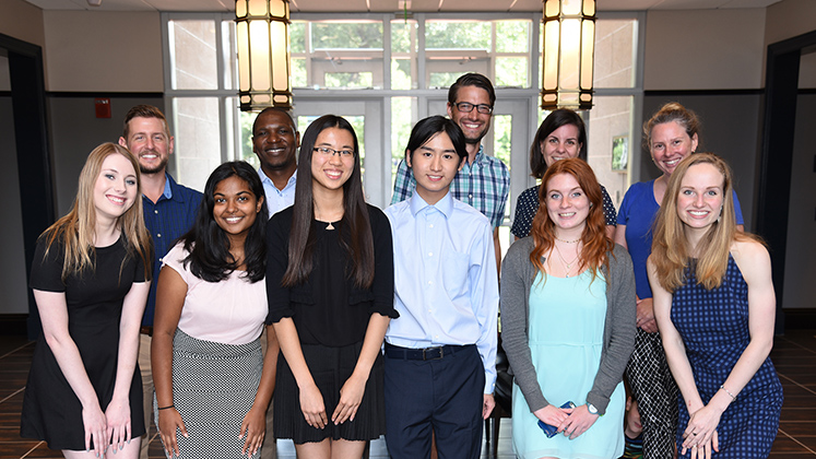 Front Row (l-r): Maggie Gunter, Sharanya Thodupunoori, Tiffany Hung, Edward Zhi-Hua Yin, Camilla Kline, and Holly Cordray. Back row (l-r): Austin Scharf, Simbarashe Nkomo, Michael Martin, Melissa Hage, and Tasha Dobbin-Bennett.