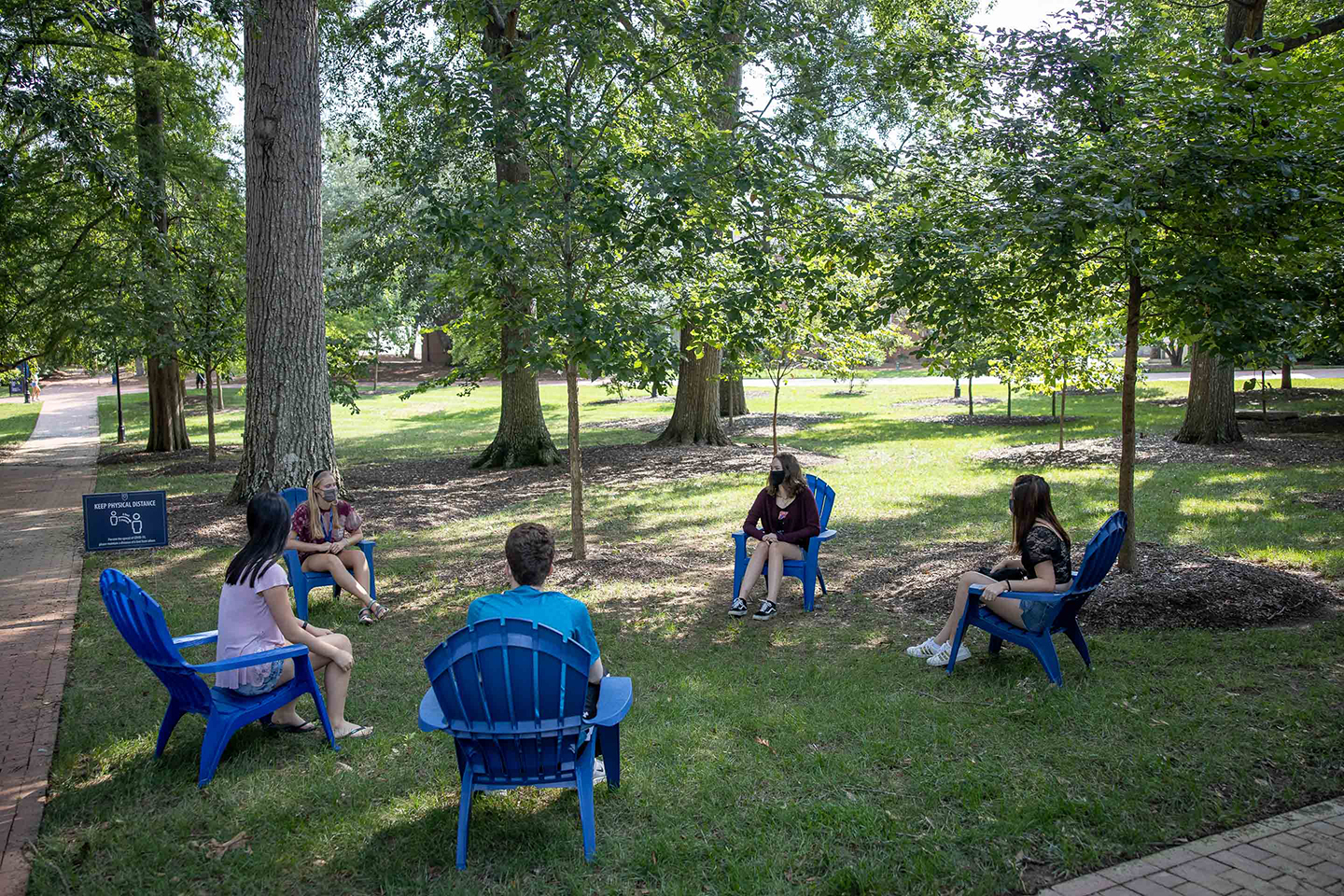 Students sit on the Oxford quad