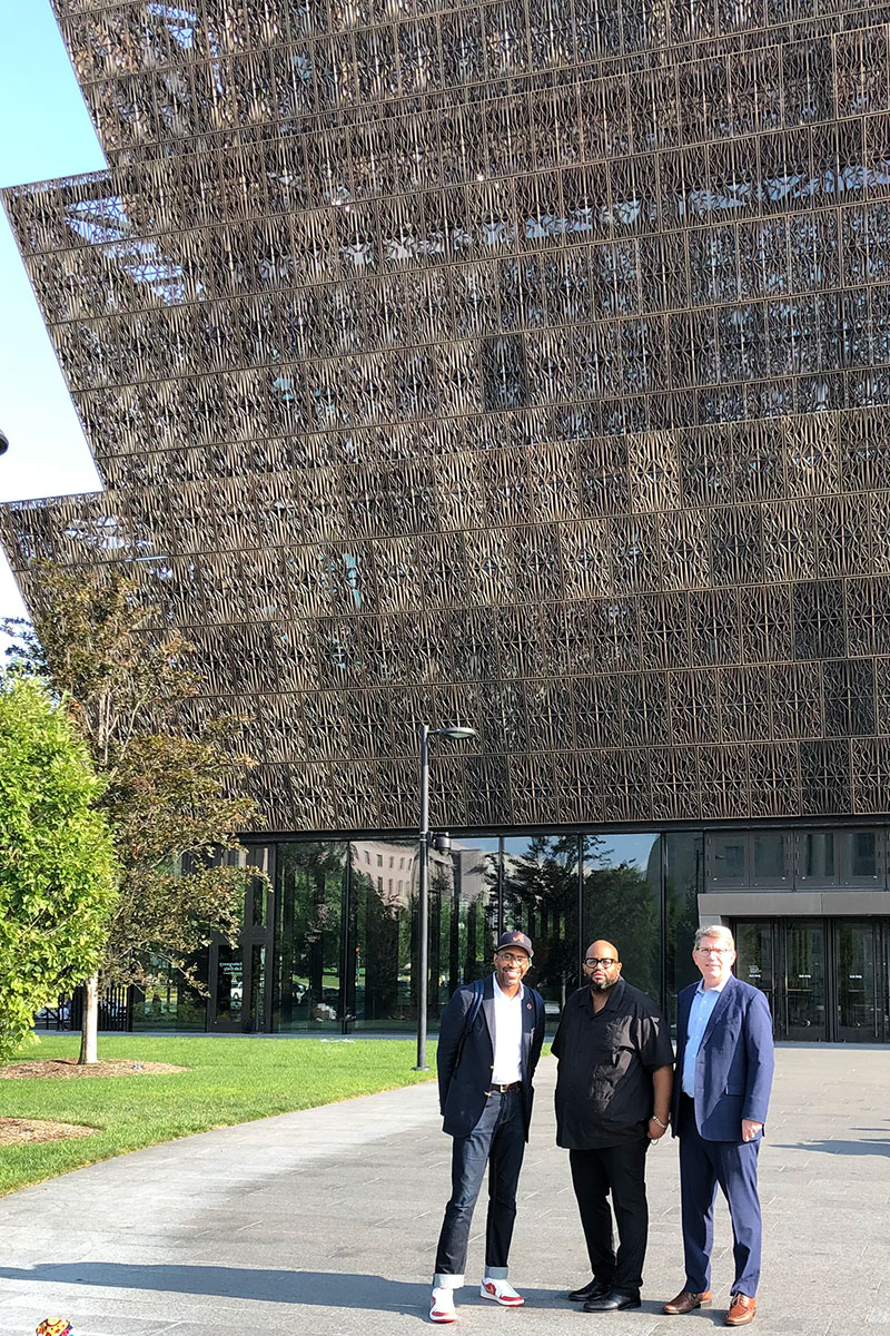 At the National Museum of African American History and Culture in Washington, D.C., Ellison (left) and Hicks (right) learned from Eric Lewis Williams (center), the museum’s curator of religion, about the importance of architectural design to narrate history.