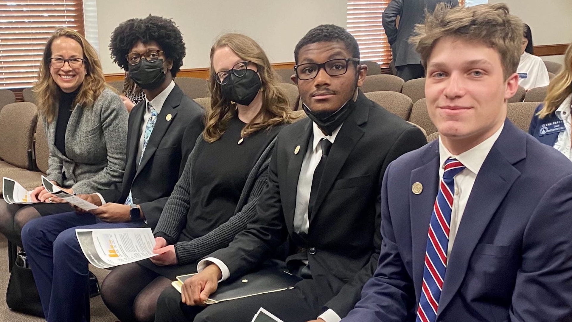 Dr. Higinbotham and students at the state legislature