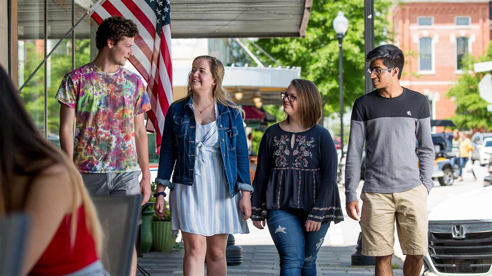 Students walk around the Covington square.