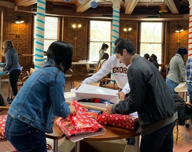 Oxford faculty and staff provide gifts, clothes, books, and food to local families in need during the holiday season 
